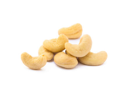 Roasted salted cashews isolated on a white backgroundの写真素材