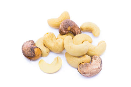 Roasted cashew nuts isolated on white backgroundの写真素材