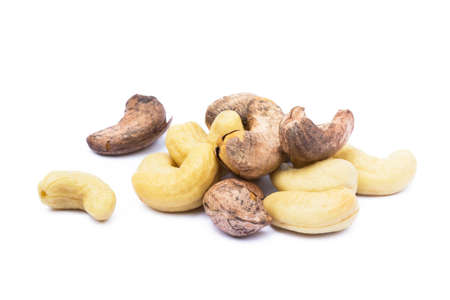 Roasted cashew nuts isolated on white backgroundの写真素材