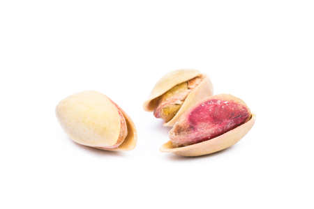 Pista of roasted pistachios isolated on white backgroundの写真素材