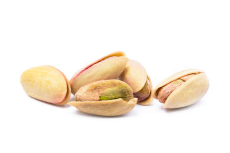 Pista of roasted pistachios isolated on white backgroundの写真素材