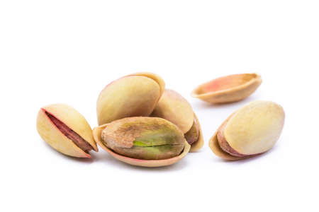Pista of roasted pistachios isolated on white backgroundの写真素材