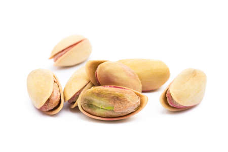 Pista of roasted pistachios isolated on white backgroundの写真素材