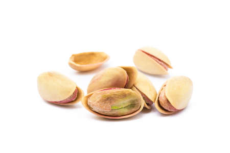 Pista of roasted pistachios isolated on white backgroundの写真素材