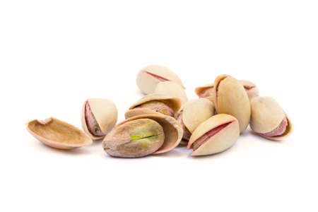 Pista of roasted pistachios isolated on white backgroundの写真素材
