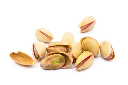 Pista of roasted pistachios isolated on white backgroundの写真素材