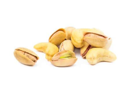 Pistachios of roasted pistachios and cashew isolated on white backgroundの写真素材