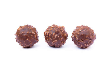 Chocolate ball candy isolated on white backgroundの写真素材