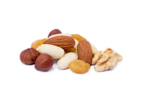 Mixed fresh nuts and raisins isolated on white backgroundの写真素材