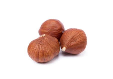 Group of fresh hazelnuts isolated on white backgroundの写真素材