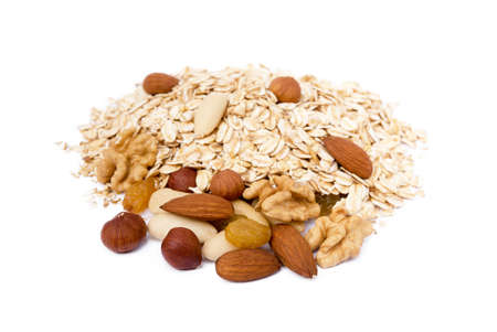 Mix nuts, raisins and oatmeal isolated on white backgroundの写真素材