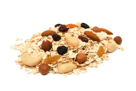 Mix nuts, raisins and oatmeal isolated on white backgroundの写真素材