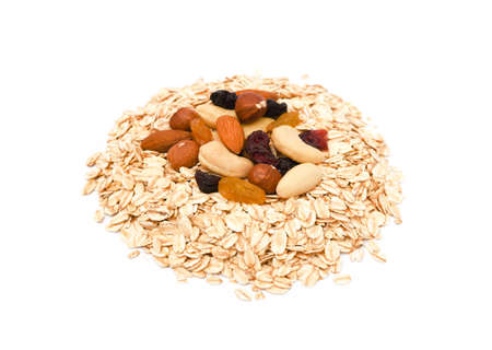 Mix nuts, raisins and oatmeal isolated on white backgroundの写真素材