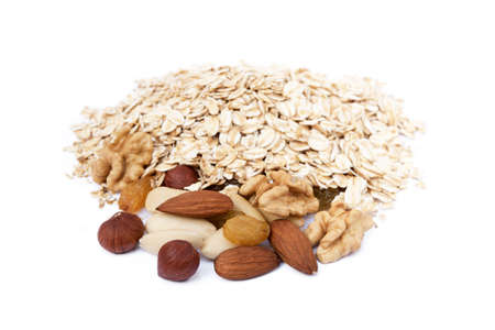 Mix nuts, raisins and oatmeal isolated on white backgroundの写真素材