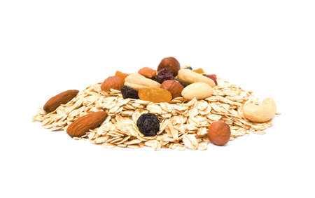 Mix nuts, raisins and oatmeal isolated on white backgroundの写真素材