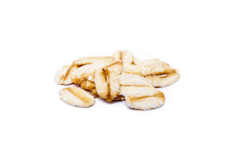 Pile of healthy oatmeal isolated on white backgroundの写真素材