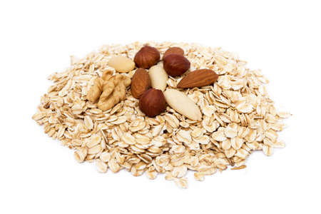 Mix nuts, raisins and oatmeal isolated on white backgroundの写真素材
