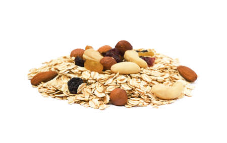 Mix nuts, raisins and oatmeal isolated on white backgroundの写真素材