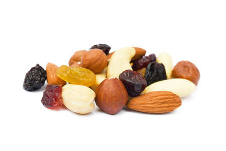 Mixed fresh nuts and raisins isolated on white backgroundの写真素材