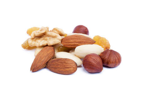 Mixed fresh nuts and raisins isolated on white backgroundの写真素材