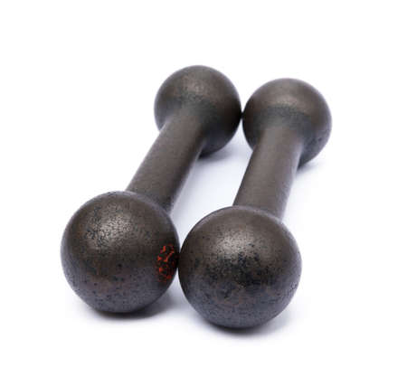 Old gym dumbbells isolated on white backgroundの写真素材