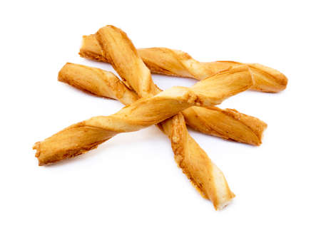Spiral bread sticks with cheese on a white backgroundの写真素材