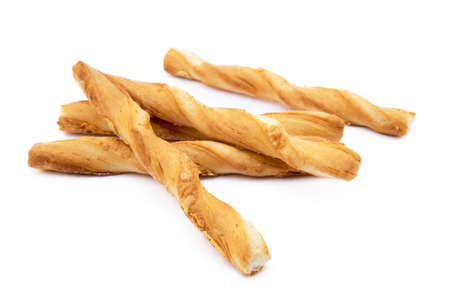 Spiral bread sticks with cheese on a white backgroundの写真素材