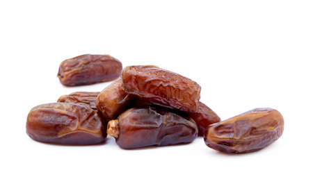 Dried sweet dates isolated on white backgroundの写真素材