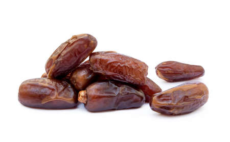 Dried sweet dates isolated on white backgroundの写真素材
