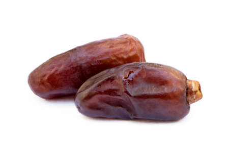 Dried sweet dates isolated on white backgroundの写真素材