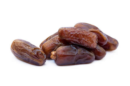 Dried sweet dates isolated on white backgroundの写真素材