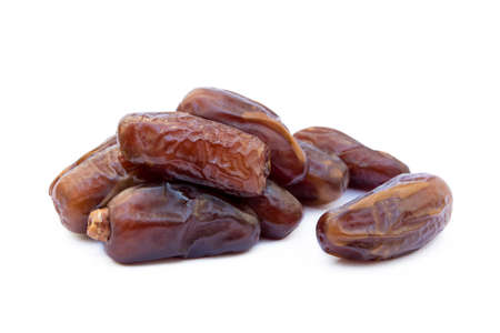 Dried sweet dates isolated on white backgroundの写真素材