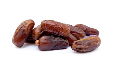 Dried sweet dates isolated on white backgroundの写真素材