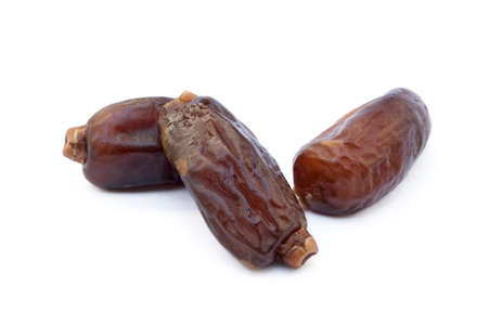 Dried sweet dates isolated on white backgroundの写真素材