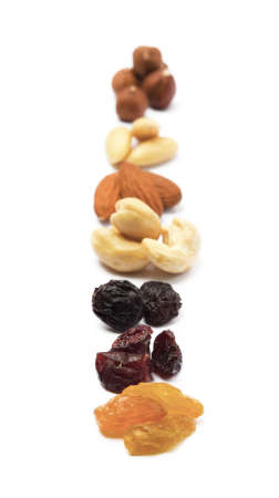Mixed fresh nuts and raisins isolated on white backgroundの写真素材