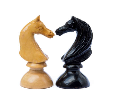 Old chess pieces isolated on white background