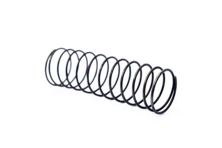 Old steel spring isolated on white backgroundの写真素材