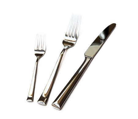 Glossy cutlery, fork isolated on white backgroundの写真素材