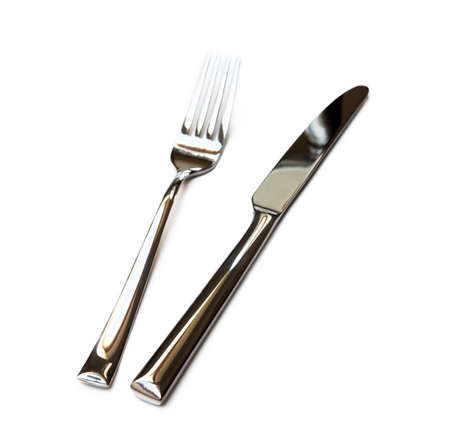 Glossy cutlery, fork isolated on white backgroundの写真素材
