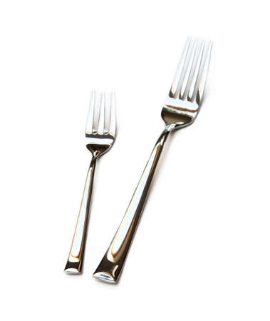 Glossy cutlery, fork isolated on white backgroundの写真素材