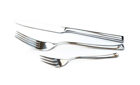 Glossy cutlery, fork, knife isolated on white backgroundの写真素材