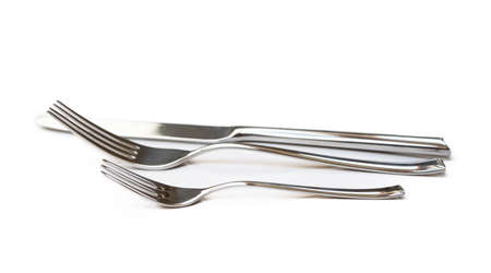 Glossy cutlery, fork, knife isolated on white backgroundの写真素材