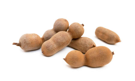Ripe sweet tamarind isolated on white backgroundの写真素材
