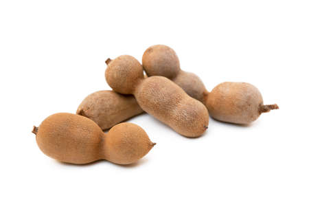 Ripe sweet tamarind isolated on white backgroundの写真素材