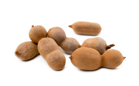 Ripe sweet tamarind isolated on white backgroundの写真素材