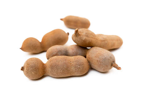 Ripe sweet tamarind isolated on white backgroundの写真素材