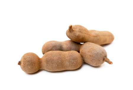 Ripe sweet tamarind isolated on white backgroundの写真素材