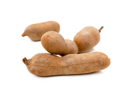 Ripe sweet tamarind isolated on white backgroundの写真素材