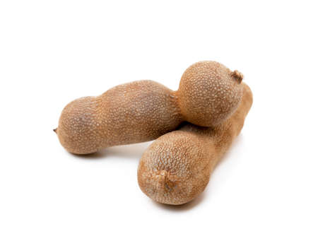 Ripe sweet tamarind isolated on white backgroundの写真素材