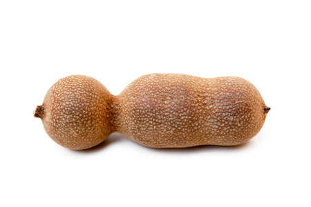 Ripe sweet tamarind isolated on white backgroundの写真素材